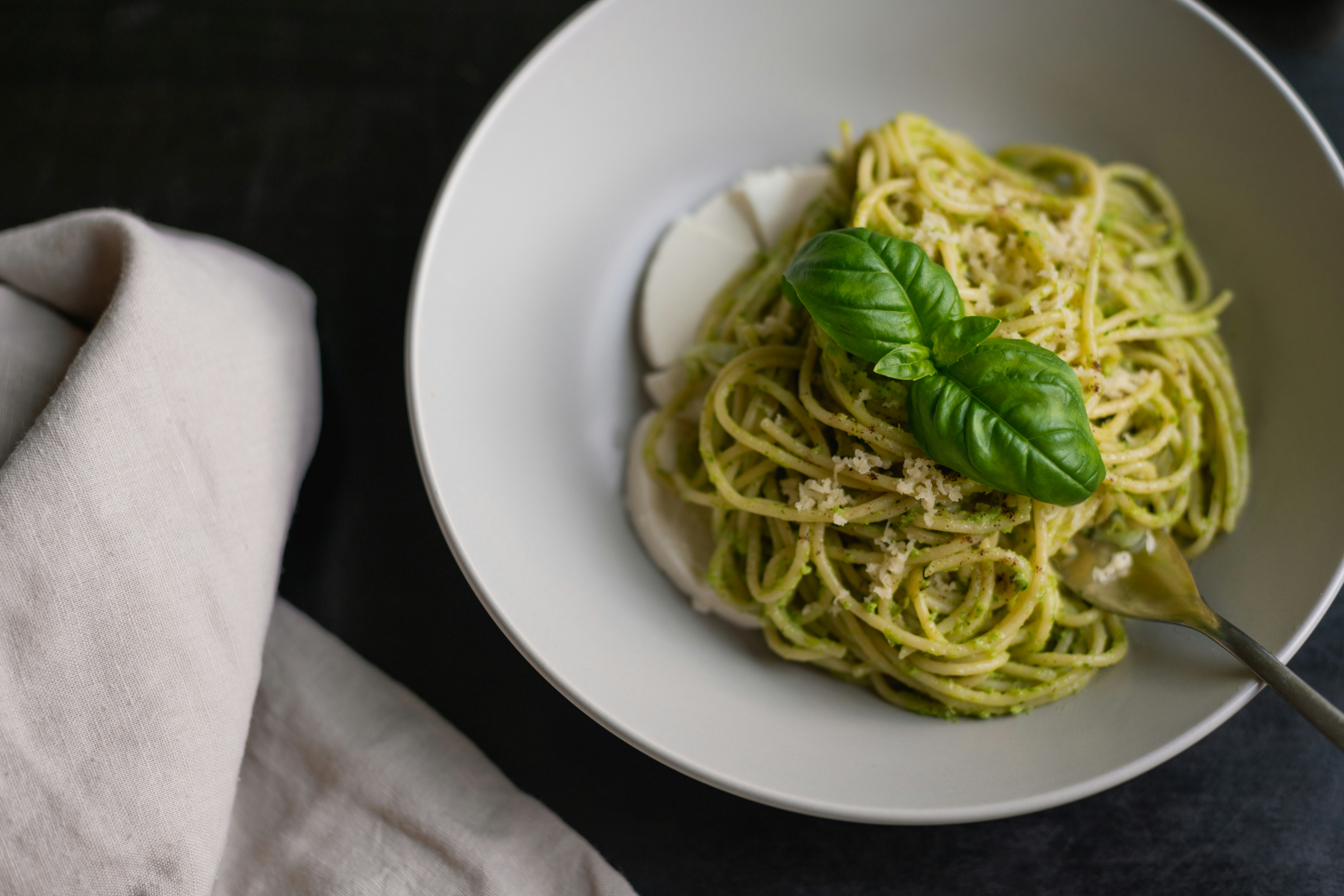 pesto pasta with basil garnish